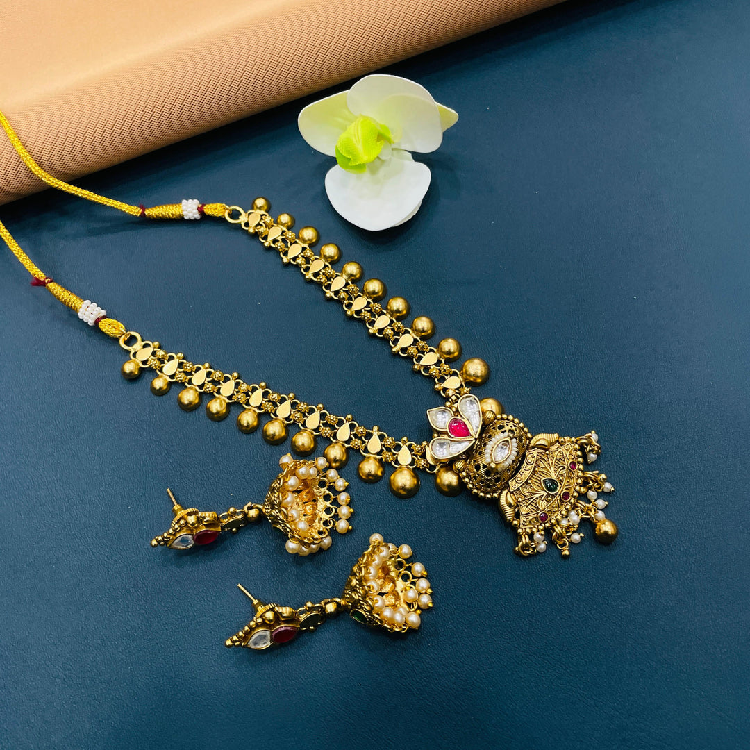 Gold antique choker set with classic Indian designs, a perfect choice for traditional celebrations.
