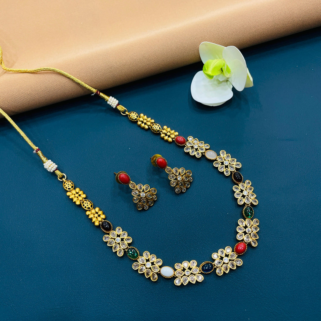 Authentic gold-tone choker set with antique Indian detailing, ideal for weddings and formal events.