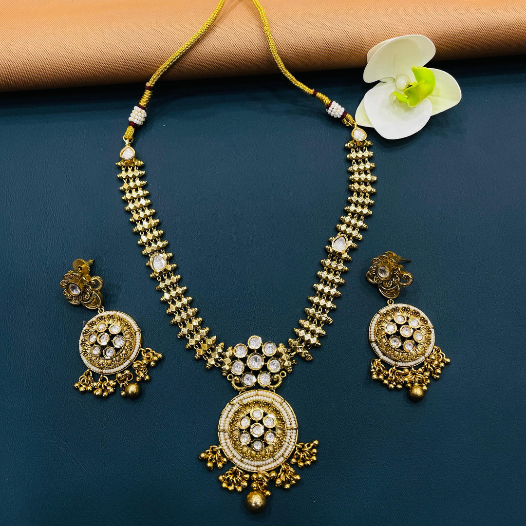 Designer antique choker in gold, crafted with classic Indian patterns for an elegant cultural look.