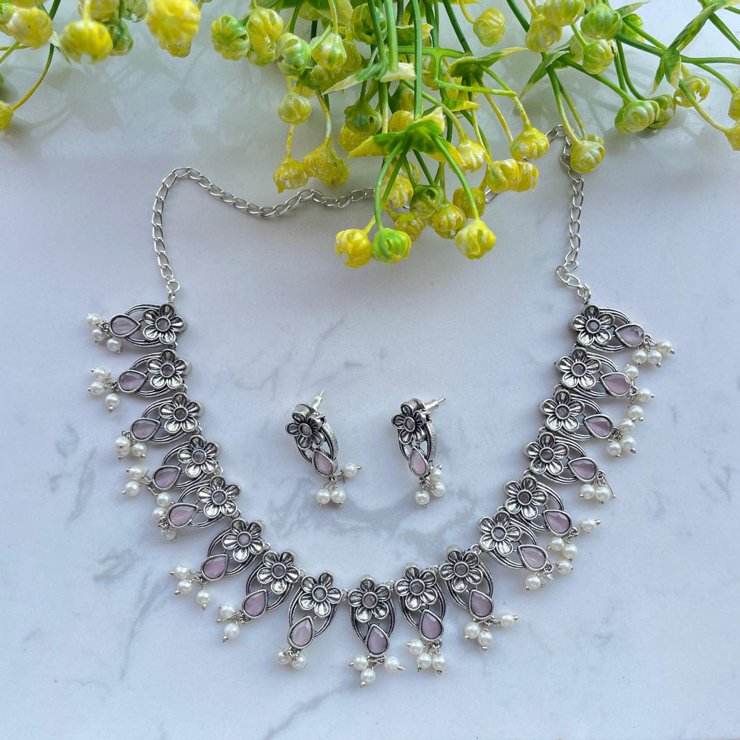 Elegant oxidised jewelry set with intricate designs for women.