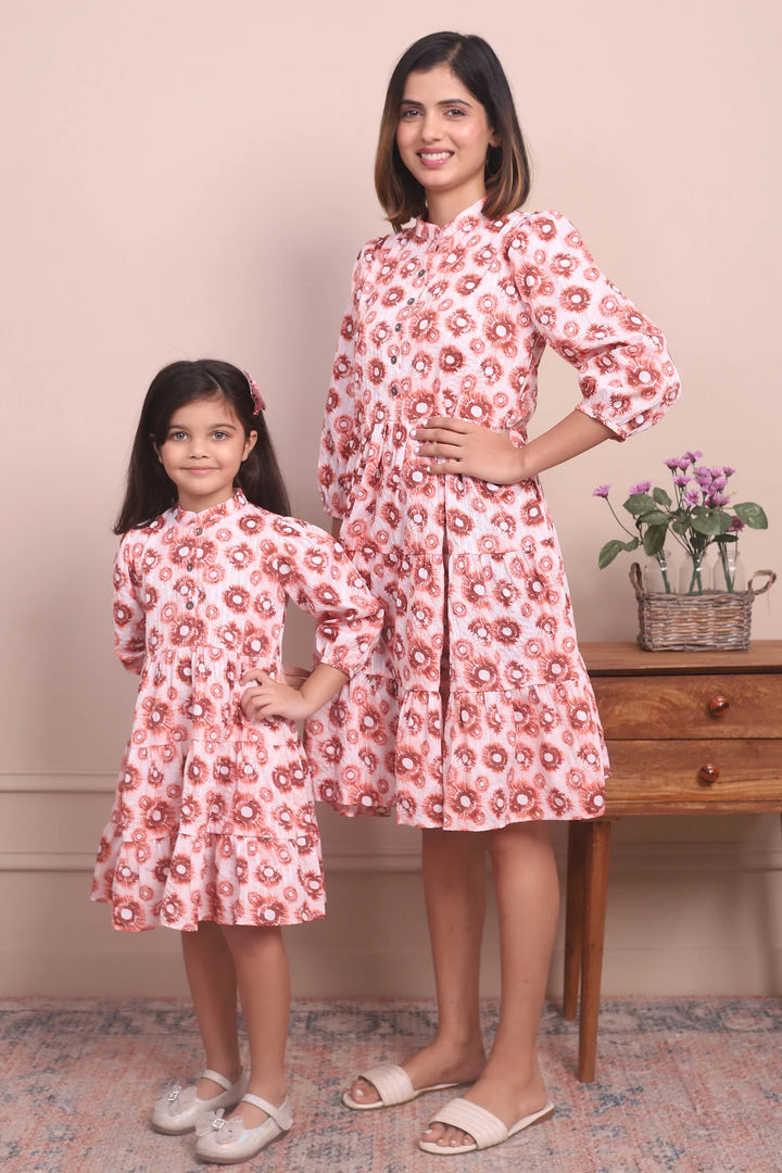 Cute and Cozy: Matching Mommy and Me Orange Printed Tiered Dress Duo
