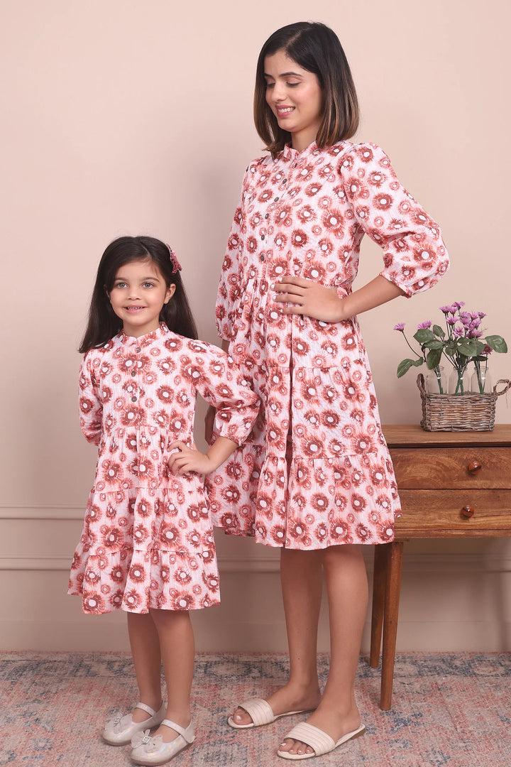 Cute and Cozy: Matching Mommy and Me Orange Printed Tiered Dress Duo