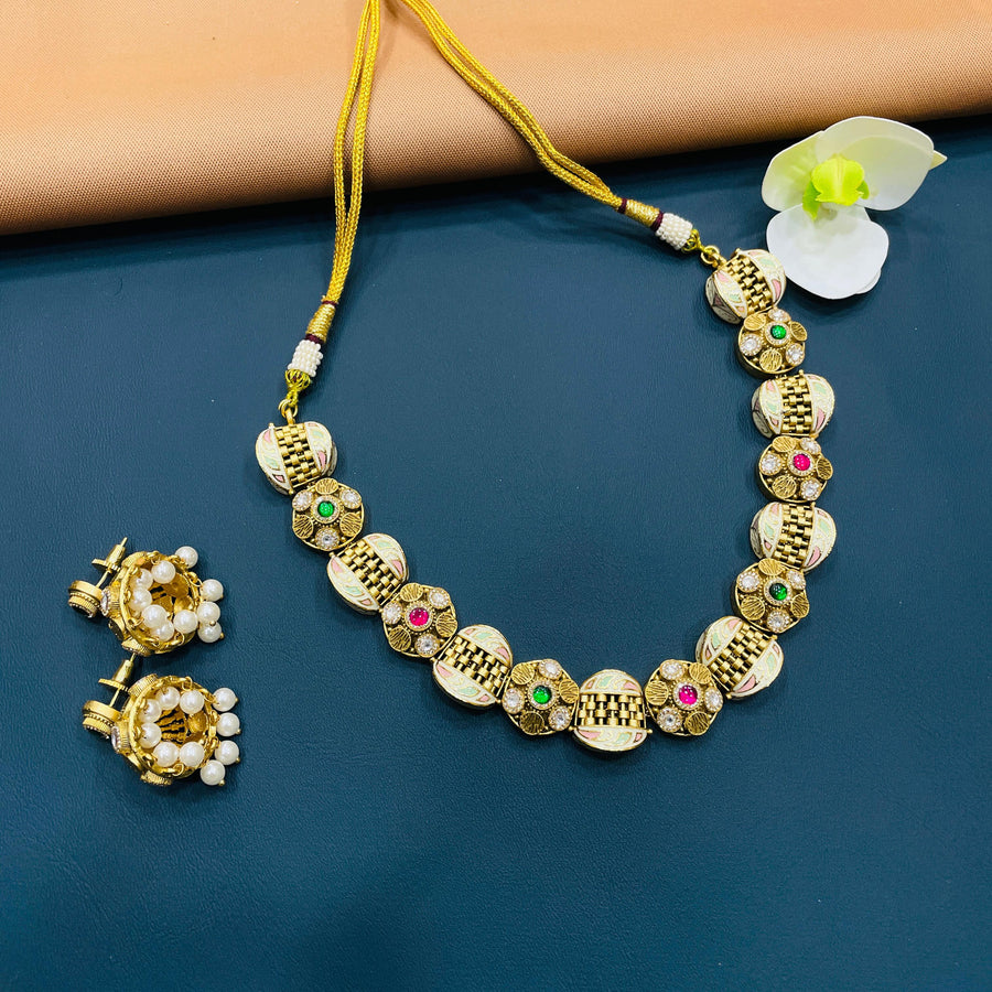 Gold Kundan necklace with intricate detailing, crafted for Indian celebrations.