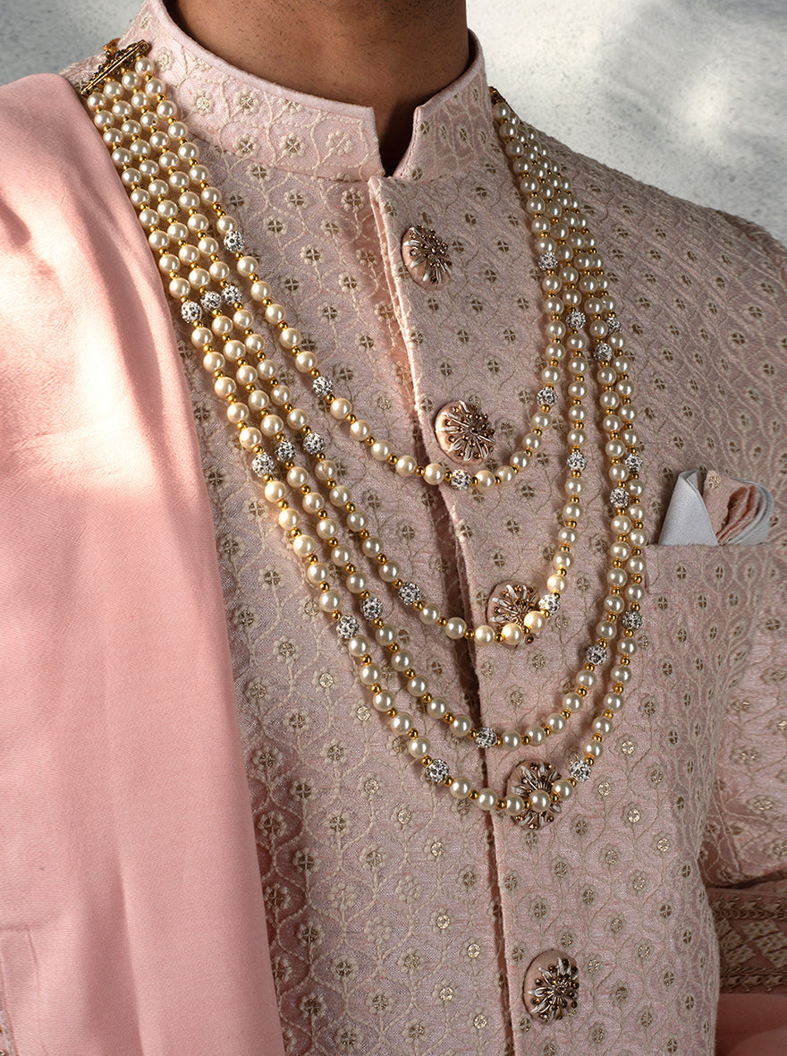 Wedding Indo Western for men in pink with detailed embroidery, loafers, and a brooch for a smart look.