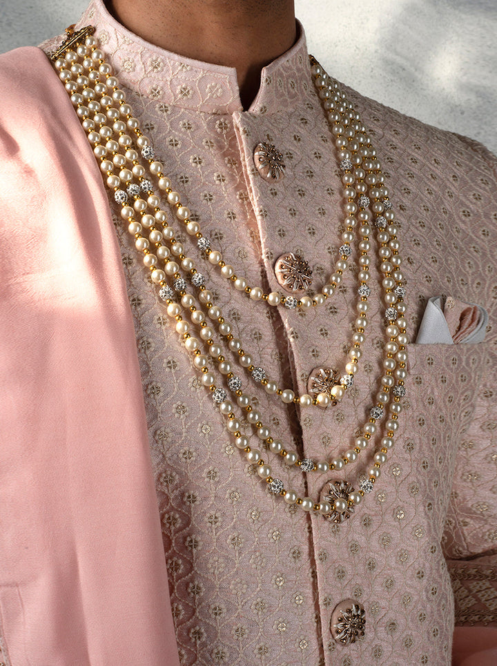 Wedding Indo Western for men in pink with detailed embroidery, loafers, and a brooch for a smart look.