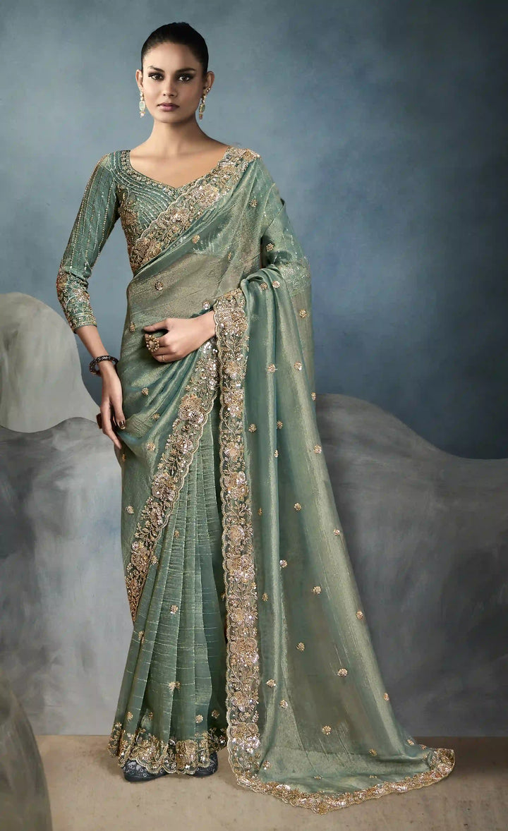 Luxurious Tissue Saree in Green with Handwork Detailing