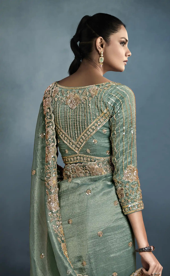 Luxurious Tissue Saree in Green with Handwork Detailing