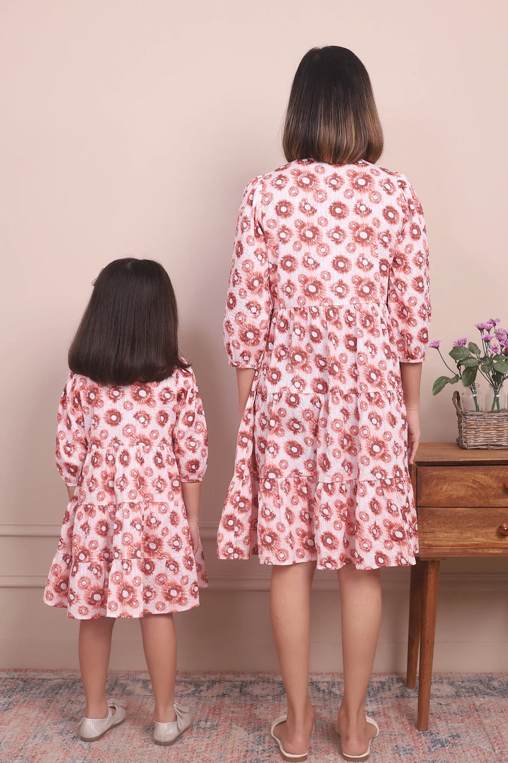 Cute and Cozy: Matching Mommy and Me Orange Printed Tiered Dress Duo