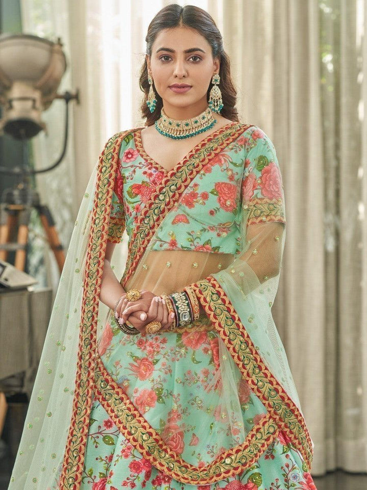 Traditional mint green lehenga with floral print and dori work lace.