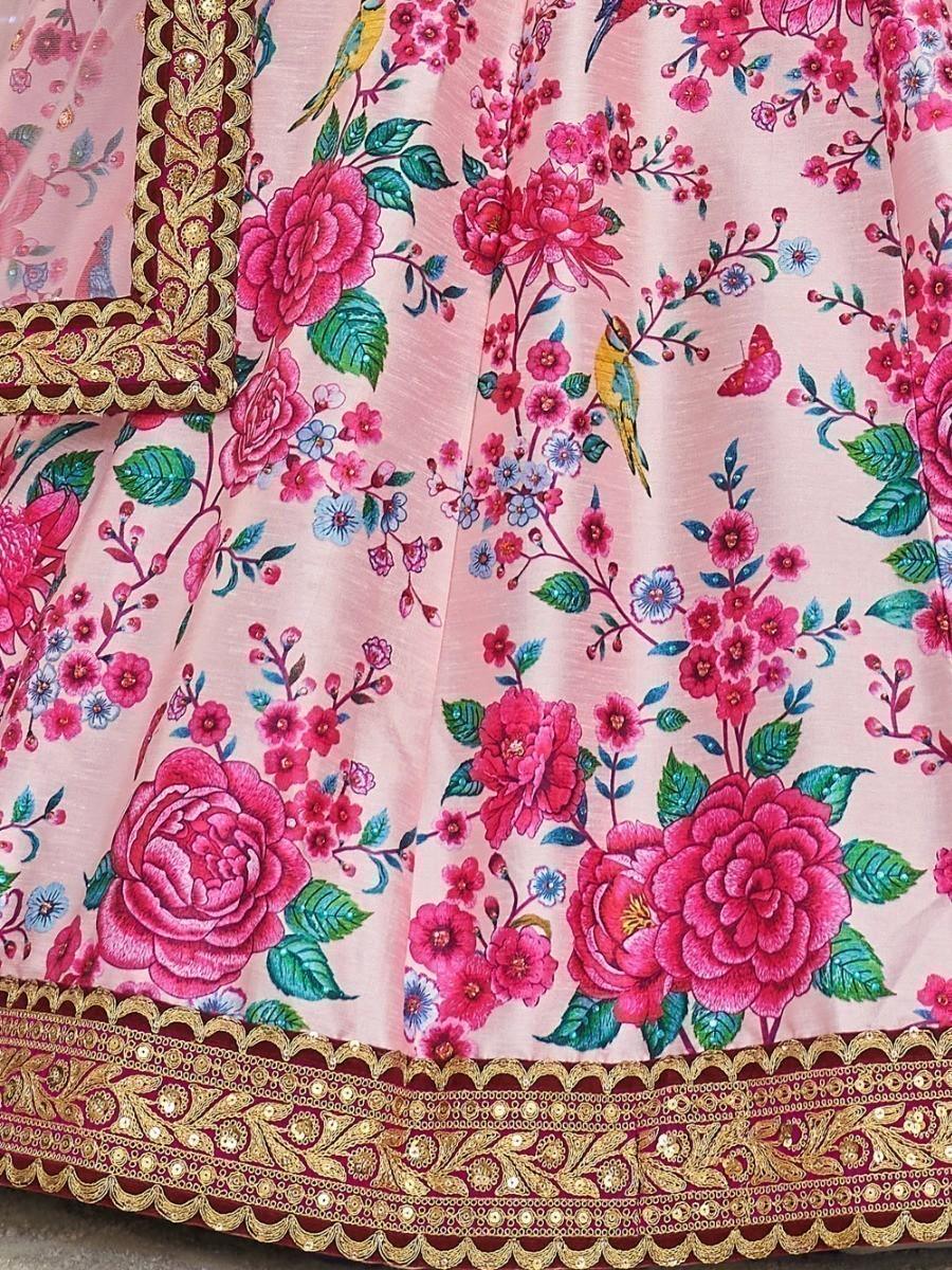 Bridal lehenga choli in pink, adorned with stonework and embroidered lace.