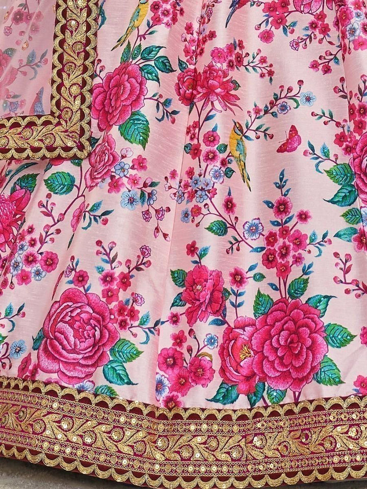 Bridal lehenga choli in pink, adorned with stonework and embroidered lace.