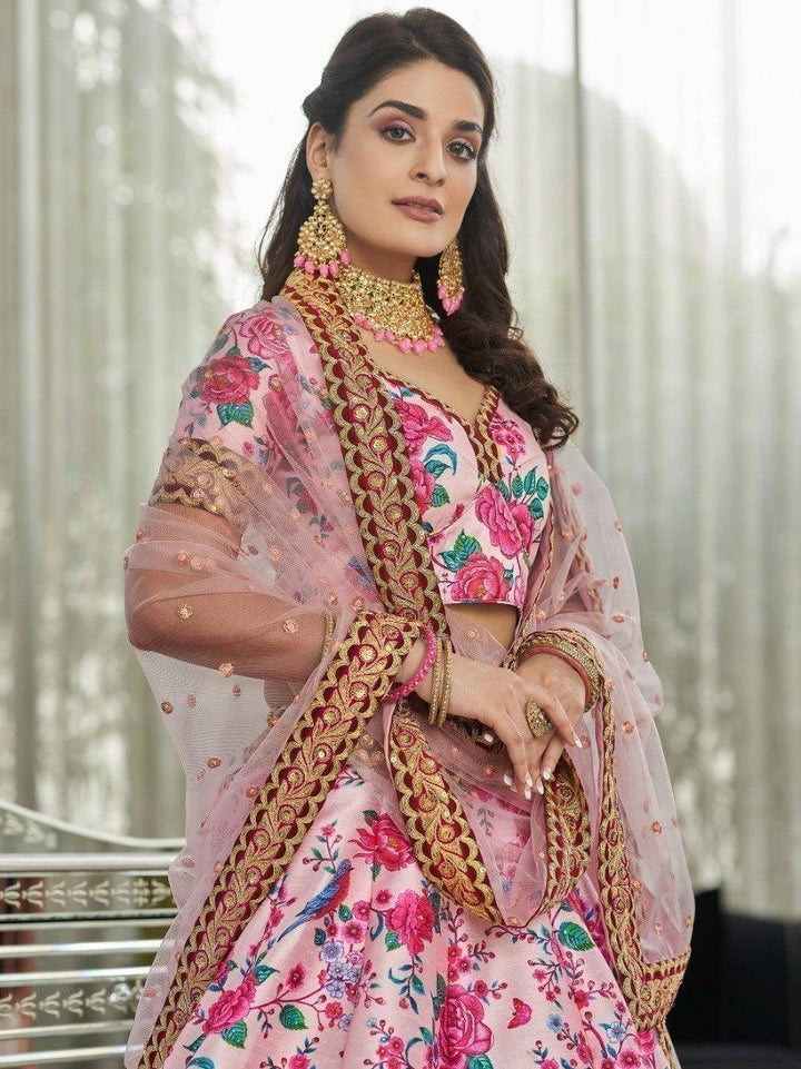 Party wear lehenga in light pink with floral and sequin detailing for a stunning look.