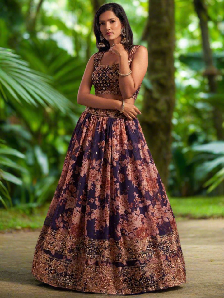 Organza purple lehenga dress with matching embroidered choli and dupatta.