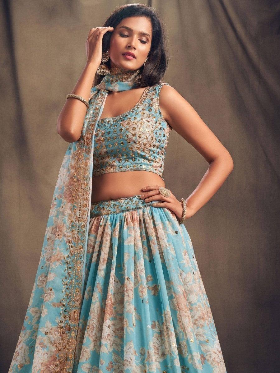 Traditional sky blue lehenga with floral design and sequins work.