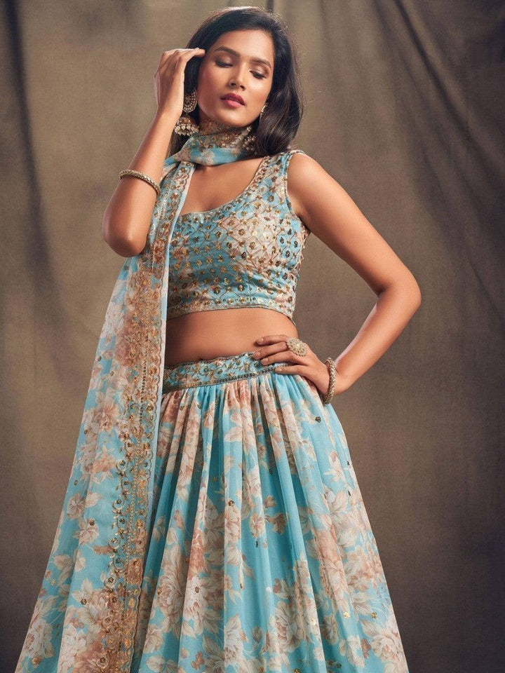 Traditional sky blue lehenga with floral design and sequins work.
