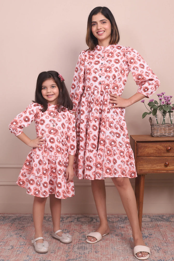 Cute and Cozy: Matching Mommy and Me Orange Printed Tiered Dress Duo