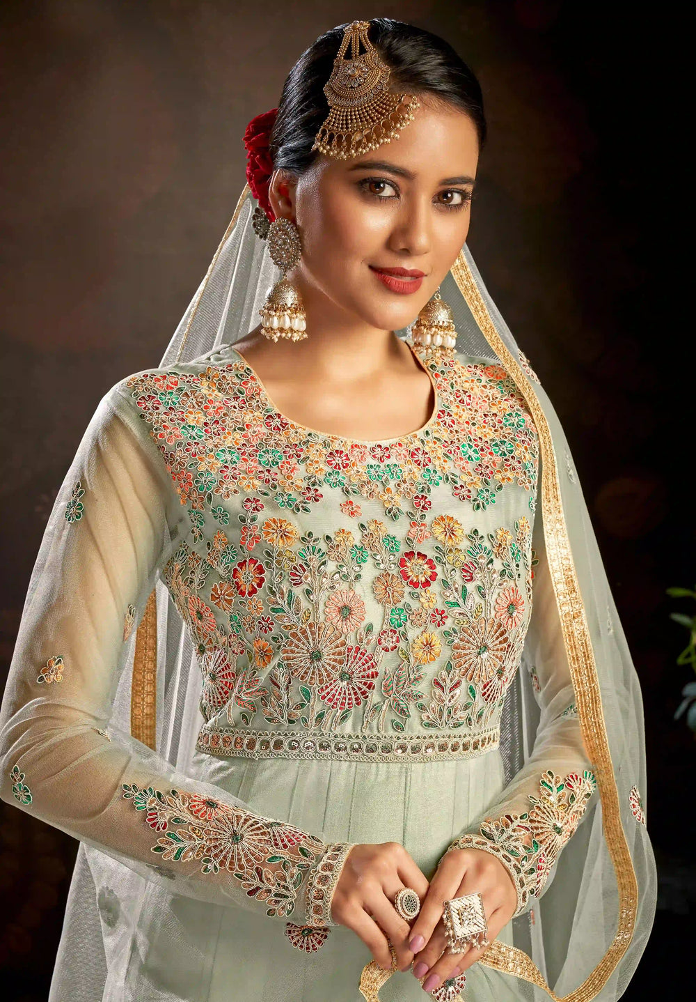 Back view a beautiful pakistani bride in a green Anarkali suit.