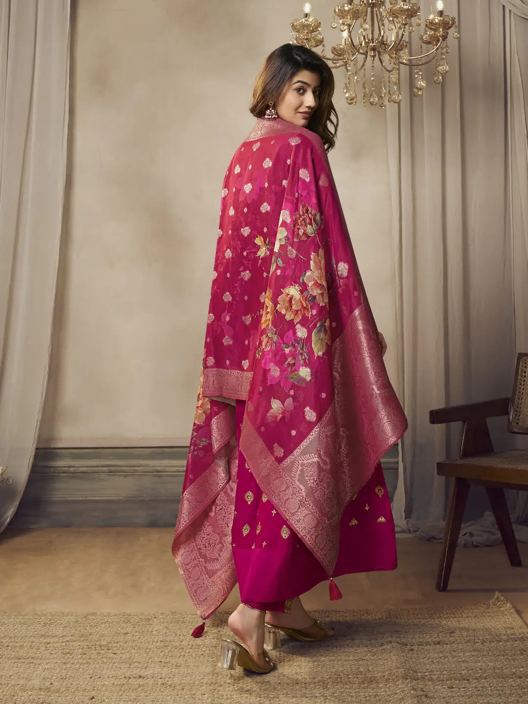 Side view pink silk embroidered suit with floral print.