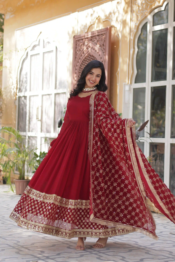 Side view red and gold Anarkali suit.