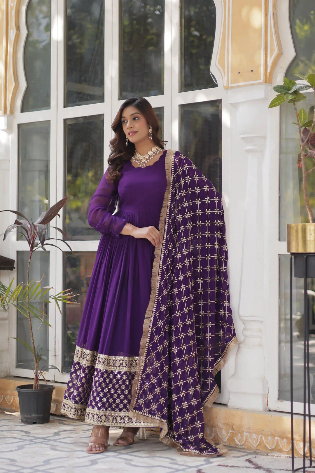 Full view purple and gold embroidered Anarkalili suit.