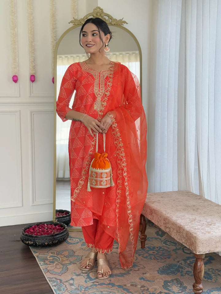 Charming Orange Crepe Salwar Kameez with Organza Dupatta