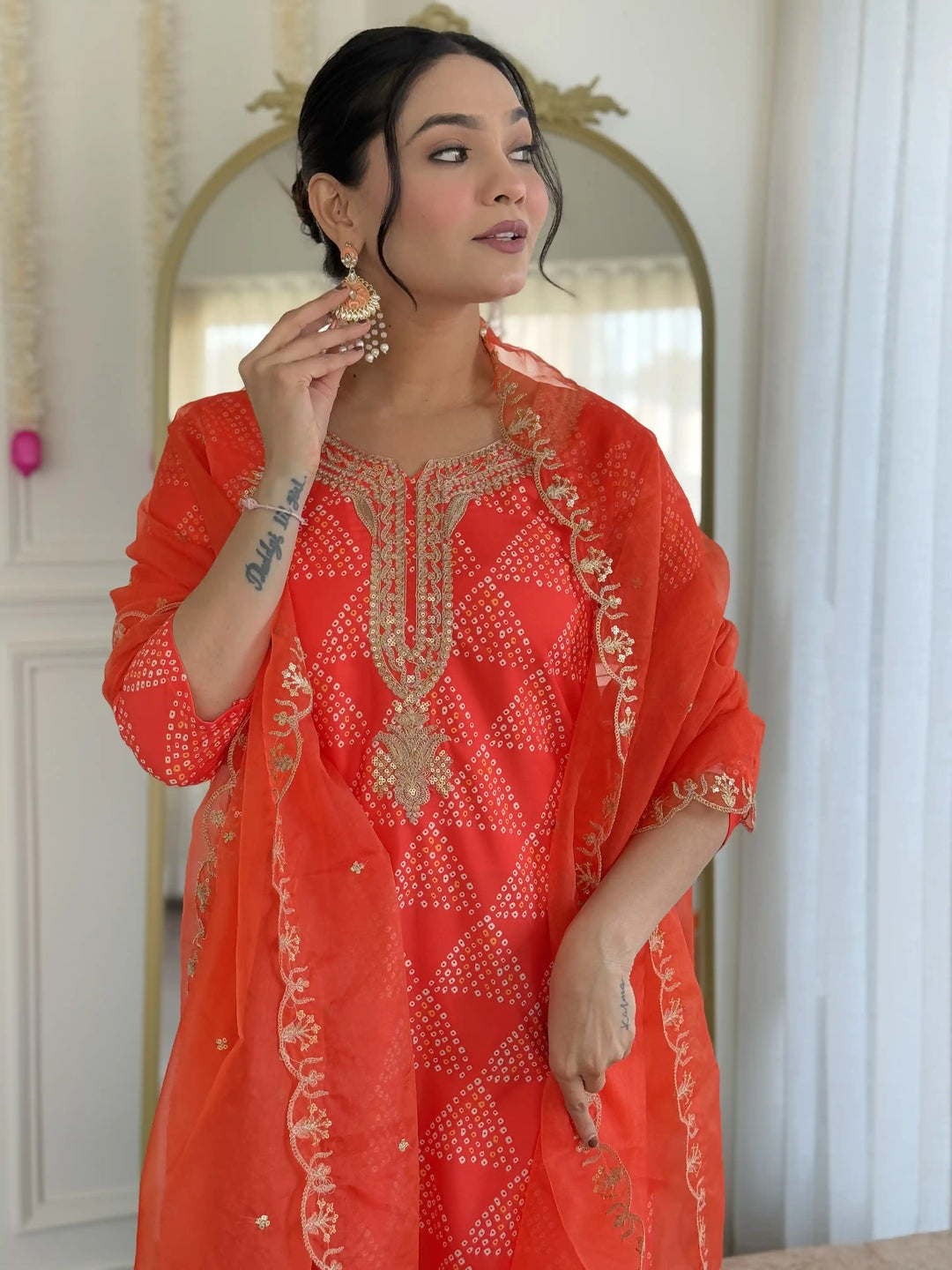 Charming Orange Crepe Salwar Kameez with Organza Dupatta