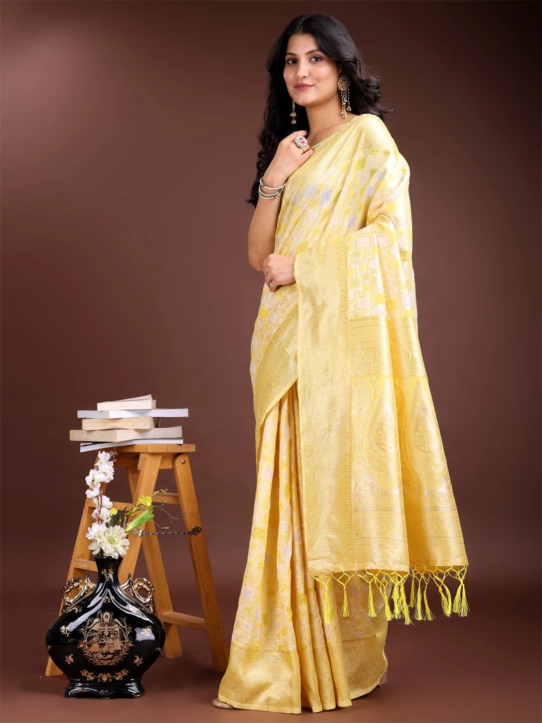 Bright yellow saree with designer blouse piece

