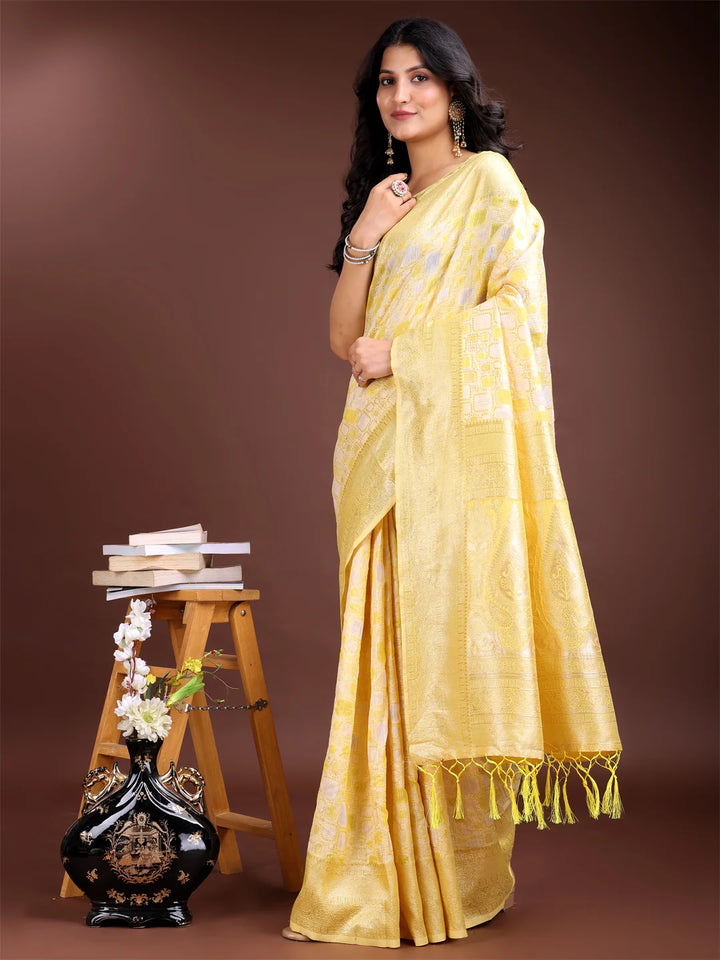 Bright yellow saree with designer blouse piece

