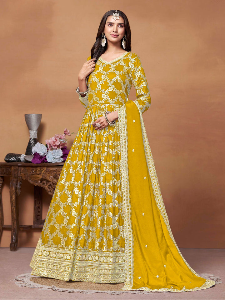 Elegant mustard dola jacquard salwar kameez featuring exquisite thread embroidery, perfect for festive occasions.