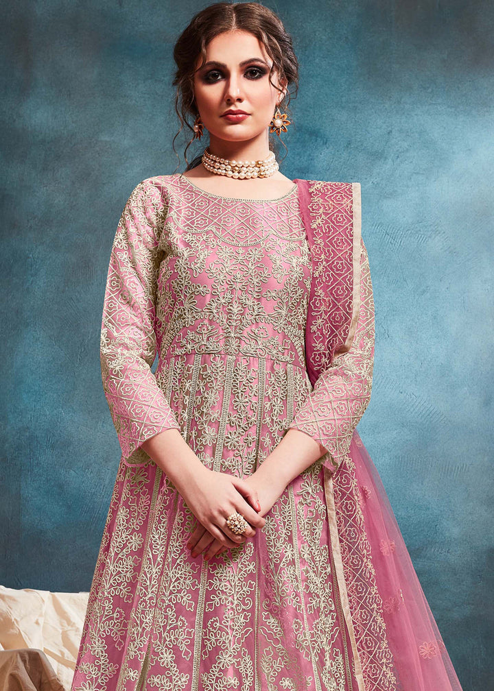 Chic light pink Anarkali Set showcasing elegant craftsmanship, perfect for festive occasions and special events.