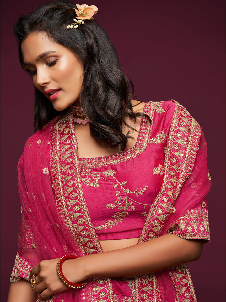 Elegant pink lehenga choli with lace border and net dupatta