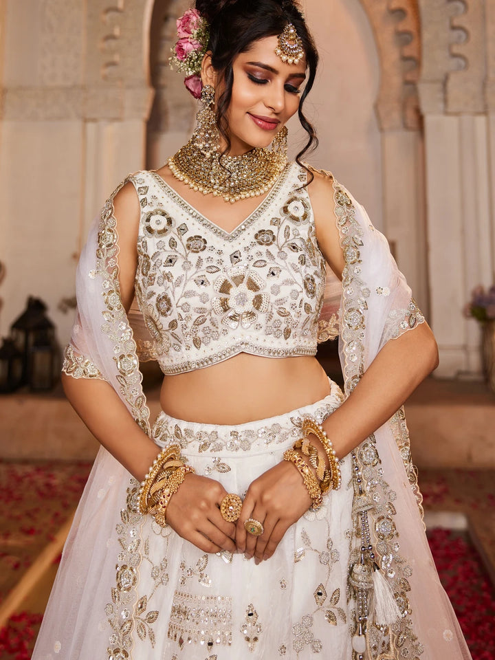 Designer off-white lehenga with subtle shimmer