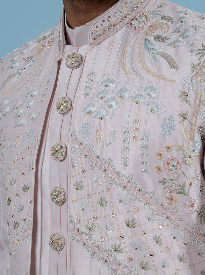 Embroidered men’s pink attire, classic and festive