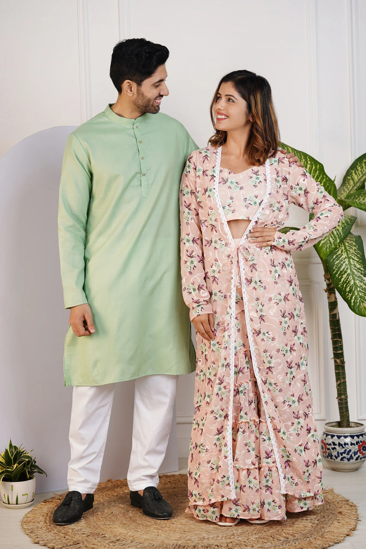 Charming Peach Floral Crop Top with Comfy Pants and Shrug, Paired with a Green Kurta and White Pyjama Matching Couple Set