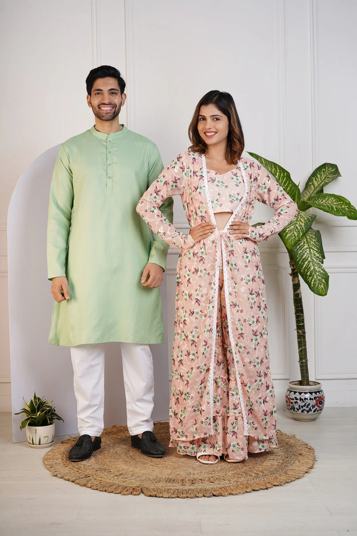 Charming Peach Floral Crop Top with Comfy Pants and Shrug, Paired with a Green Kurta and White Pyjama Matching Couple Set