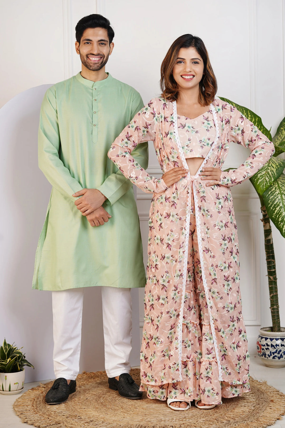 Charming Peach Floral Crop Top with Comfy Pants and Shrug, Paired with a Green Kurta and White Pyjama Matching Couple Set