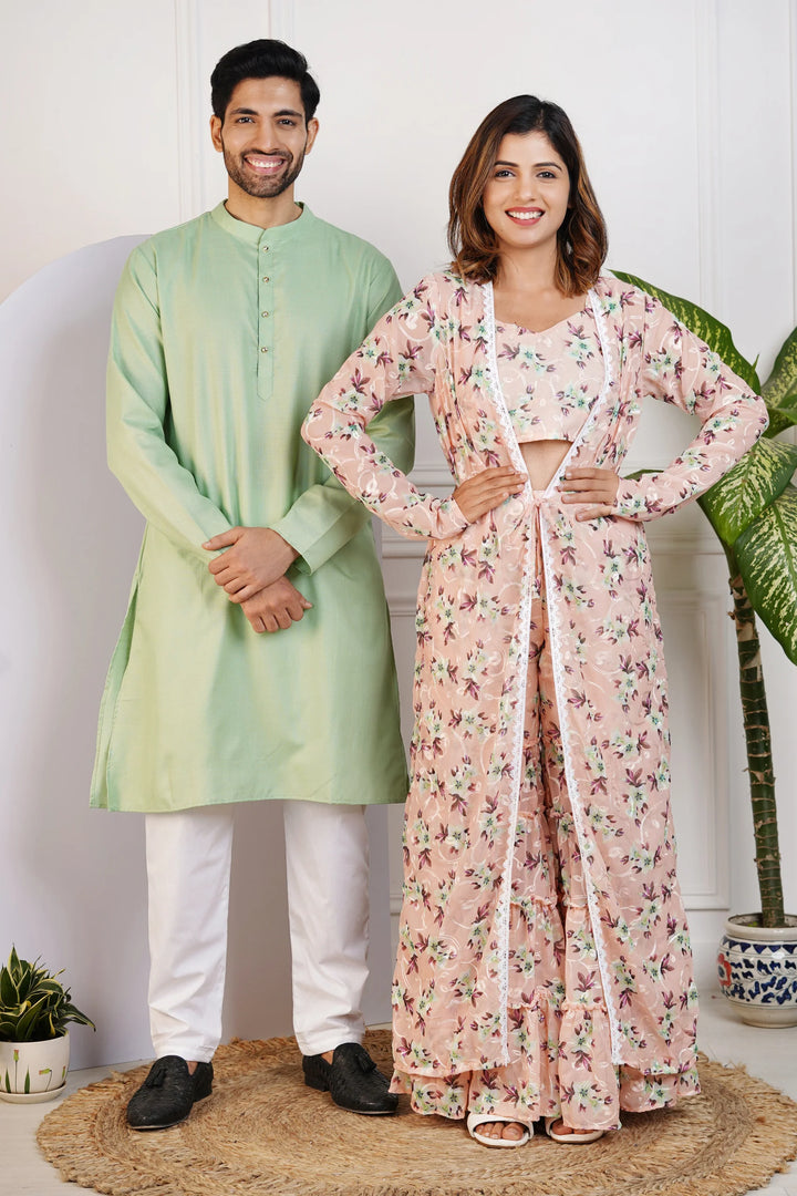 Charming Peach Floral Crop Top with Comfy Pants and Shrug, Paired with a Green Kurta and White Pyjama Matching Couple Set