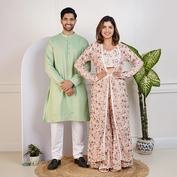 Charming Peach Floral Crop Top with Comfy Pants and Shrug, Paired with a Green Kurta and White Pyjama Matching Couple Set