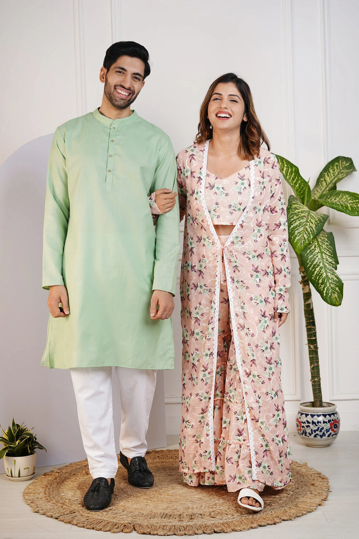 Charming Peach Floral Crop Top with Comfy Pants and Shrug, Paired with a Green Kurta and White Pyjama Matching Couple Set