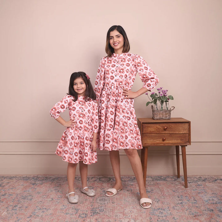 Cute and Cozy: Matching Mommy and Me Orange Printed Tiered Dress Duo