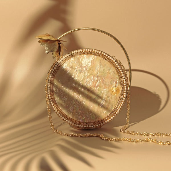 Naaz Embellished Mother of Pearl Clutch | Elegant Brass Flower Handle Bag