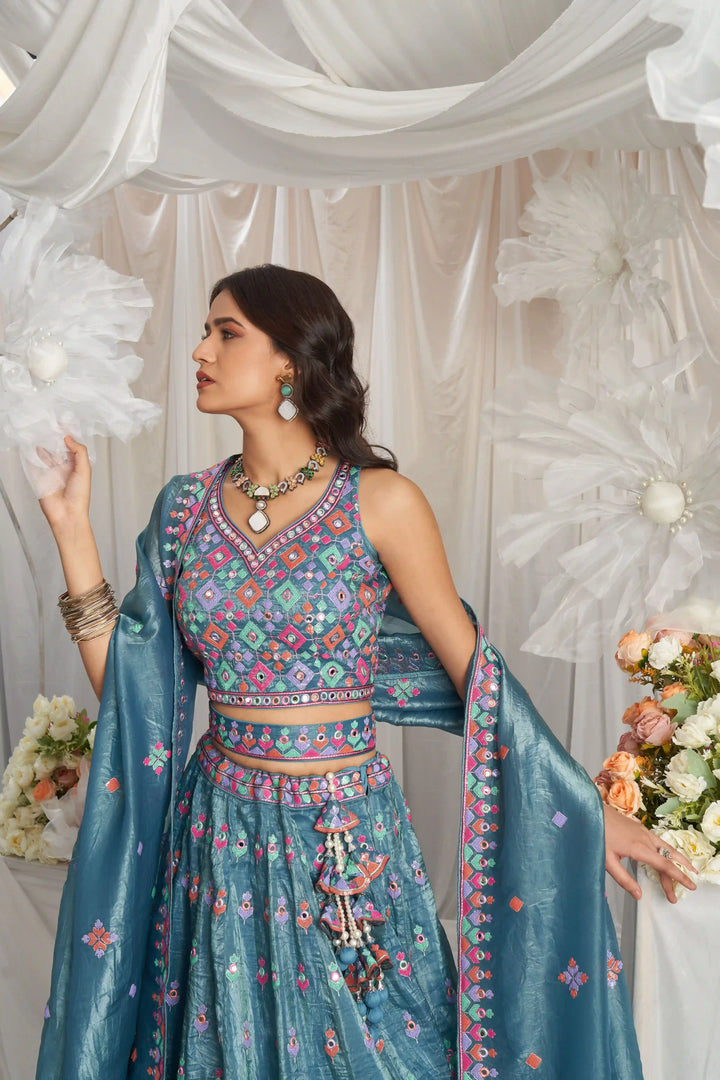 Order dark teal blue lehenga choli with intricate embroidery