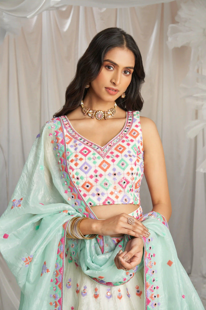 Order off-white embroidered lehenga choli for festive wear