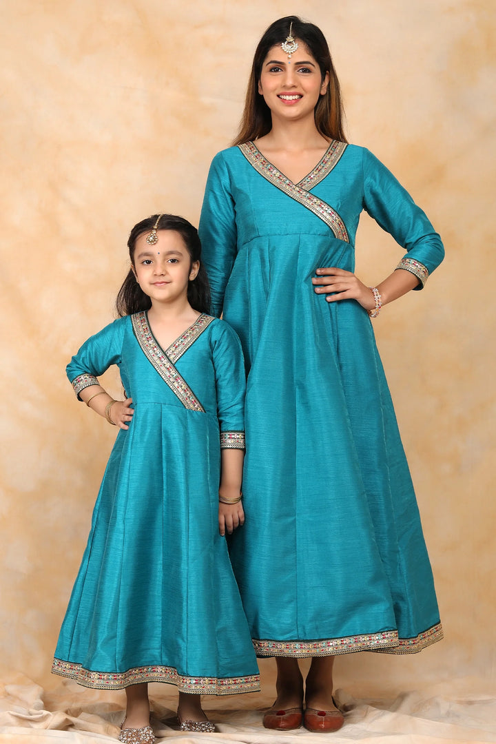 Exquisite Peacock Blue Ethnic Silk Gown Set for Mom and Daughter – Perfectly Coordinated Twin Outfits