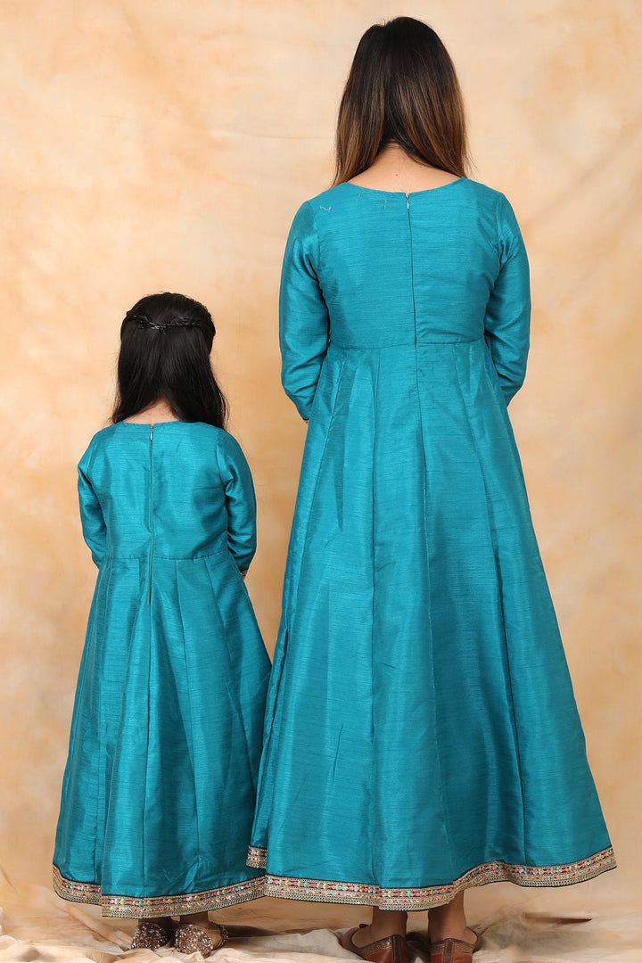 Exquisite Peacock Blue Ethnic Silk Gown Set for Mom and Daughter – Perfectly Coordinated Twin Outfits