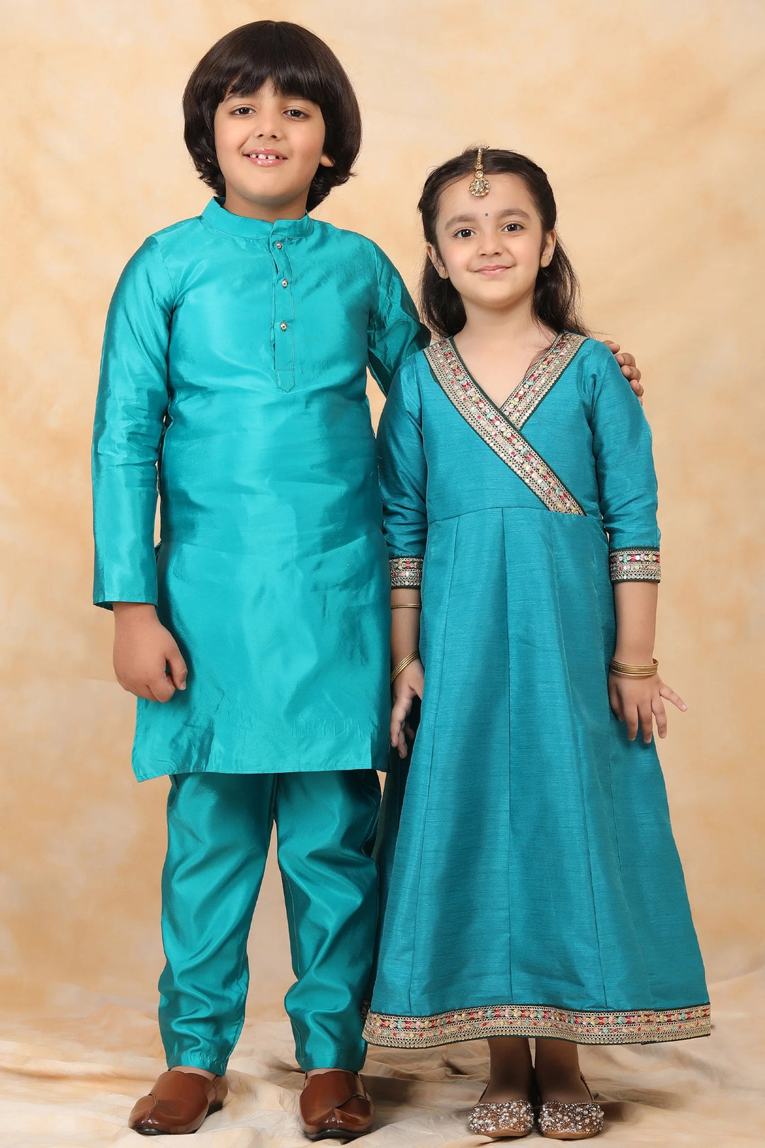 Enchanting Elegance: Peacock Green Angrakha Gown and Matching Kurta Pyjama Twin Set for Brother and Sister