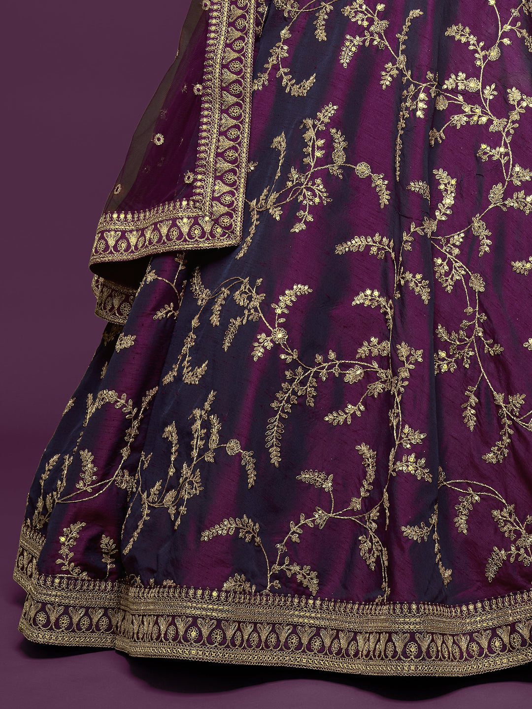 Elegant purple art silk lehenga with attached can-can for wedding wear.