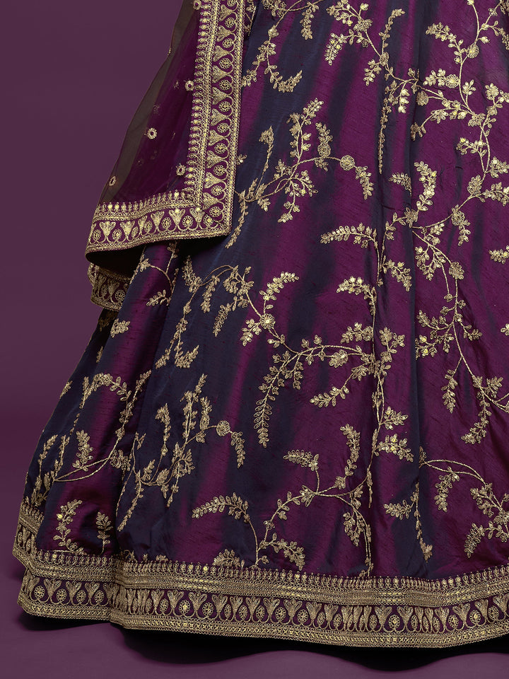 Elegant purple art silk lehenga with attached can-can for wedding wear.