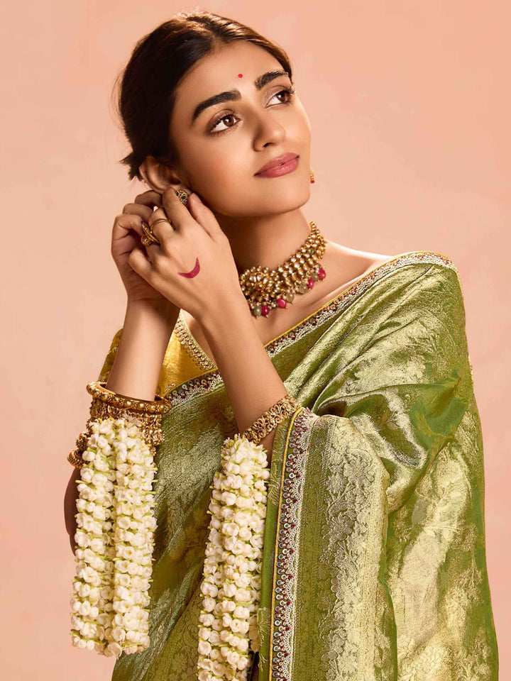 Delightful Green Zari Weaving Silk Mehendi Wear Saree With Blouse