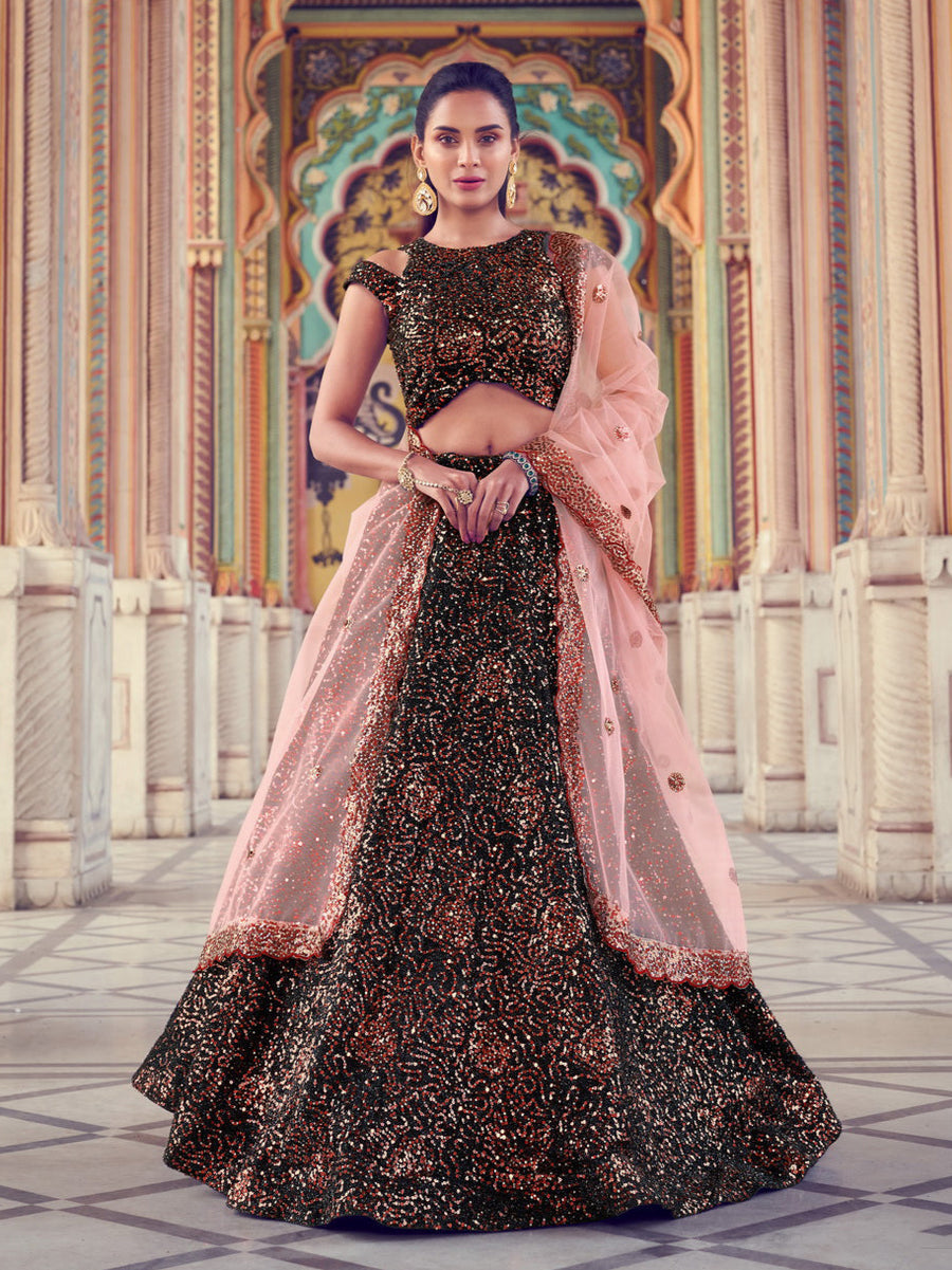 Shop black lehenga with sparkling patterns and peach dupatta for festive wear